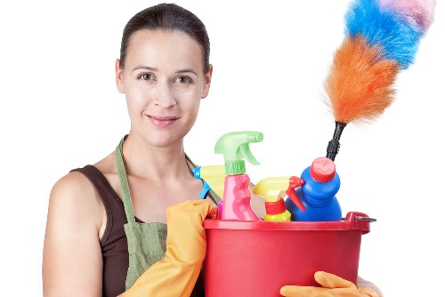 Professional carpet cleaner in Hammersmith deep cleaning a living room carpet